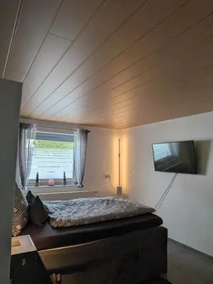 Ein Bett oder Betten in einem Zimmer der Unterkunft Ferienhaus An der Quell
