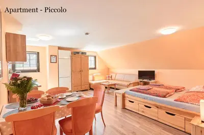 Ein Bett oder Betten in einem Zimmer der Unterkunft Villa Vici - Ferienwohnungen