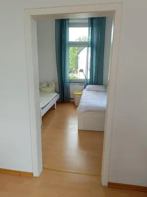 Ein Bett oder Betten in einem Zimmer der Unterkunft Wohnung am Schlosspark