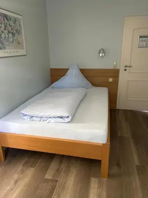 Ein Bett oder Betten in einem Zimmer der Unterkunft Hotel-Restaurant Jägerhof