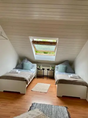 Ein Bett oder Betten in einem Zimmer der Unterkunft Charmante Dachgeschosswohnung bis zu 6 Gäste