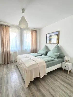 Ein Bett oder Betten in einem Zimmer der Unterkunft Ferienwohnung Burgstraße