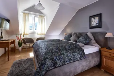 Ein Bett oder Betten in einem Zimmer der Unterkunft Gästehaus Classisches Weingut Hoffranzen