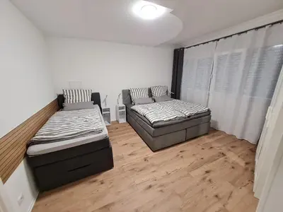 Ein Bett oder Betten in einem Zimmer der Unterkunft Ferienwohnungen Hilt