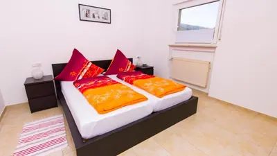Ein Bett oder Betten in einem Zimmer der Unterkunft Weingut Roth