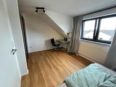 Ein Bett oder Betten in einem Zimmer der Unterkunft Modern Wohnung in der Nähe von Koblenz