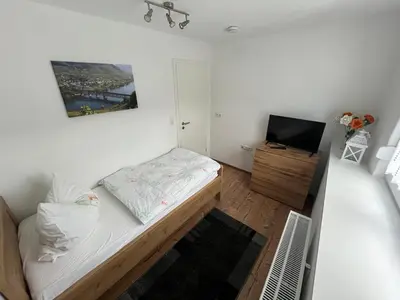 Ein Bett oder Betten in einem Zimmer der Unterkunft Ferienwohnungen und Appartements - Haus Budinger