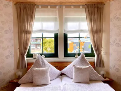 Ein Bett oder Betten in einem Zimmer der Unterkunft Zwei gepflegte Gästezimmer mit eigenem Bad