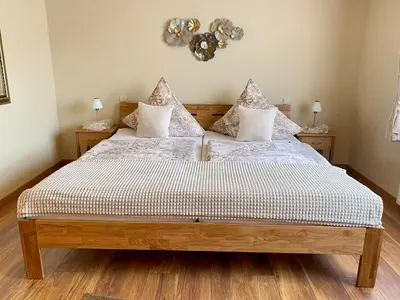 Ein Bett oder Betten in einem Zimmer der Unterkunft Zwei gepflegte Gästezimmer mit eigenem Bad