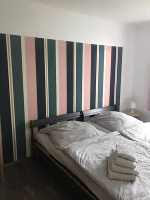 Ein Bett oder Betten in einem Zimmer der Unterkunft GUTE ZEIT Ferienwohnung