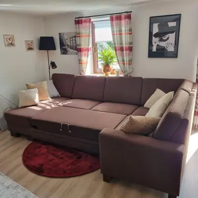 Ein Sitzbereich in der Unterkunft Ferienwohnung Zum Freihof