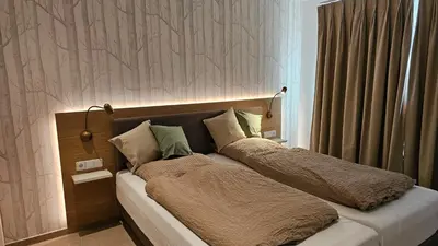 Ein Bett oder Betten in einem Zimmer der Unterkunft Landhaus Wald und See