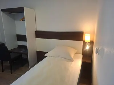 Ein Bett oder Betten in einem Zimmer der Unterkunft Hotel Zens