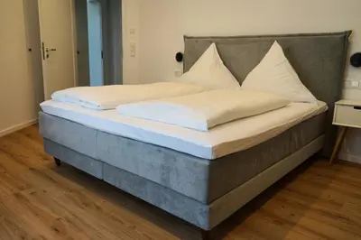 Ein Bett oder Betten in einem Zimmer der Unterkunft Hain Estate Appartements