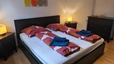 Ein Bett oder Betten in einem Zimmer der Unterkunft Spacious Ferienwohnung nähe KOB Uni