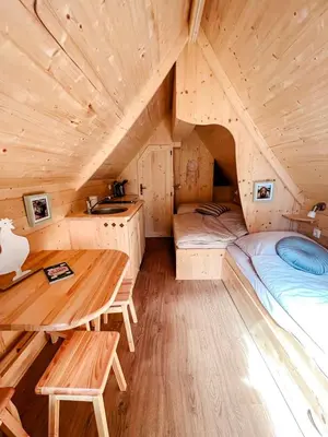 Ein Bett oder Betten in einem Zimmer der Unterkunft Cozy Wooden Cabin Perfect for Small Families in Germany