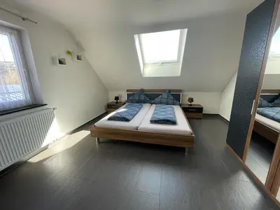 Ein Bett oder Betten in einem Zimmer der Unterkunft Ferienhaus Haus Auenland