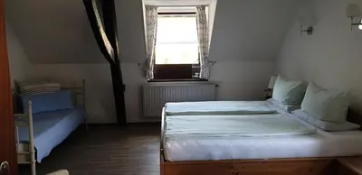 Ein Bett oder Betten in einem Zimmer der Unterkunft Serwazi-Zenzen
