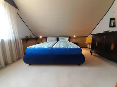 Ein Bett oder Betten in einem Zimmer der Unterkunft Gästehaus am Ahornweg