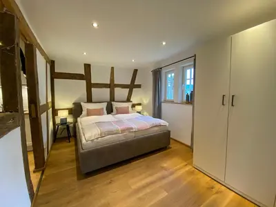 Ein Bett oder Betten in einem Zimmer der Unterkunft Weingut Bindges - Apartment Rosenhof