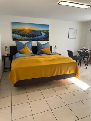 Ein Bett oder Betten in einem Zimmer der Unterkunft Moselgold Apartment