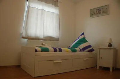 Ein Bett oder Betten in einem Zimmer der Unterkunft Wacholder am Waldsee 1
