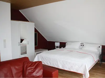 Ein Bett oder Betten in einem Zimmer der Unterkunft Ferienwohnung Kramer
