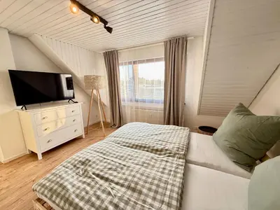 Ein Bett oder Betten in einem Zimmer der Unterkunft Ferienwohnung Stage One Zentrale Lage
