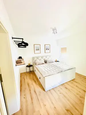 Ein Bett oder Betten in einem Zimmer der Unterkunft Ferienwohnung Stadtflair an der Lahn