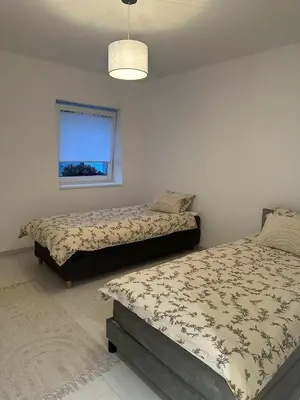 Ein Bett oder Betten in einem Zimmer der Unterkunft Domi Apartment