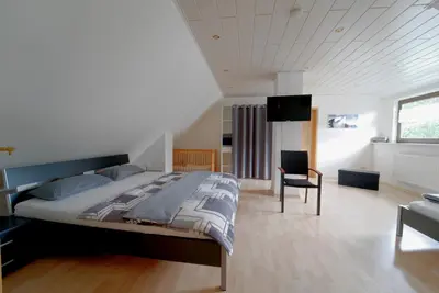 Ein Bett oder Betten in einem Zimmer der Unterkunft Ferienwohnung Hoffmann