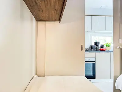 Küche/Küchenzeile in der Unterkunft Holiday Home Tiny Haus Vierseenblick Nummer 3 by Interhome