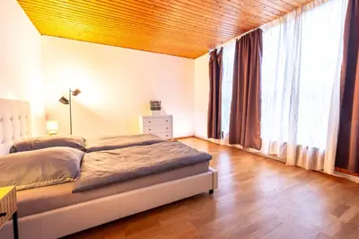 Ein Bett oder Betten in einem Zimmer der Unterkunft Rhein-Haus