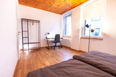 Ein Bett oder Betten in einem Zimmer der Unterkunft Rhein-Haus