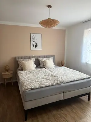 Ein Bett oder Betten in einem Zimmer der Unterkunft Ferienwohnung am Krausbach