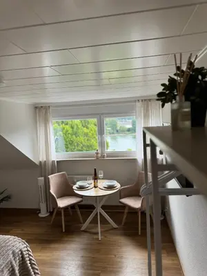 Ein Sitzbereich in der Unterkunft RheinBlick Apartment - Park and Stay 