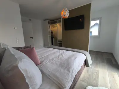 Ein Bett oder Betten in einem Zimmer der Unterkunft VILLA VULKANEIFEL -modern -familienfreundlich -Terrasse -Doppelgarage -ruhiger Lage