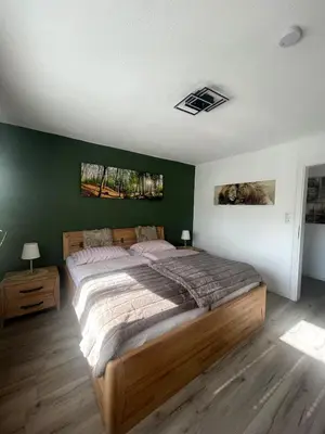 Ein Bett oder Betten in einem Zimmer der Unterkunft Eifeltraum Mendig, 3 Sterne, Ferienwohnung