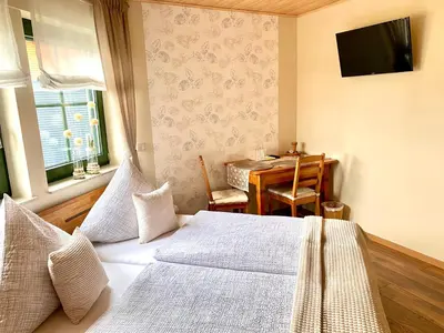 Ein Bett oder Betten in einem Zimmer der Unterkunft Gästezimmer Engels