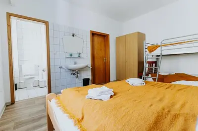 Ein Bett oder Betten in einem Zimmer der Unterkunft Gemütliches Gästehaus am Rhein!
