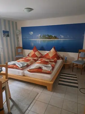 Ein Bett oder Betten in einem Zimmer der Unterkunft Pension Müller