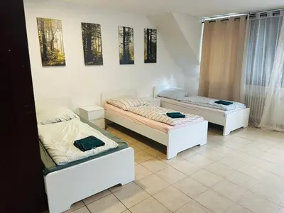 Ein Bett oder Betten in einem Zimmer der Unterkunft City Apartment Family & group