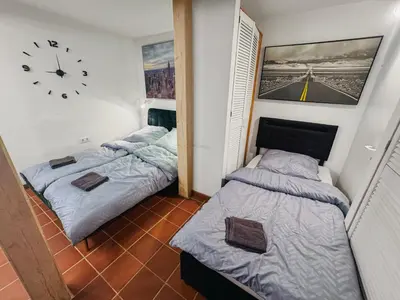 Ein Bett oder Betten in einem Zimmer der Unterkunft RheinOase mit Garten für Familien & Gruppen
