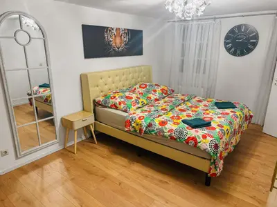 Ein Bett oder Betten in einem Zimmer der Unterkunft RheinOase mit Garten für Familien & Gruppen