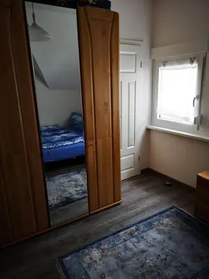 Ein Bett oder Betten in einem Zimmer der Unterkunft Das blaue Haus