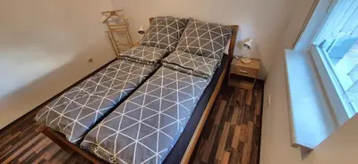 Ein Bett oder Betten in einem Zimmer der Unterkunft Ferienwohnung Heilklima