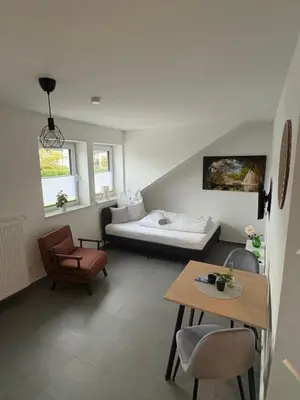 Ein Bett oder Betten in einem Zimmer der Unterkunft FeWo Mitte