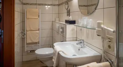 Ein Badezimmer in der Unterkunft Hotel Bisenius