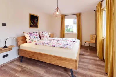 Ein Bett oder Betten in einem Zimmer der Unterkunft Ferienhaus Syrah am Weingut Regnery