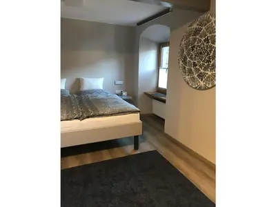 Ein Bett oder Betten in einem Zimmer der Unterkunft Old Winemaker's House Müntnich